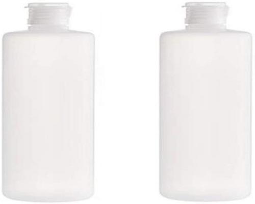 A Set Of 2 Transparent And Reusable Travel Bottle