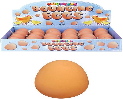 una scatola di caramelle a forma di uovo con palla di gomma