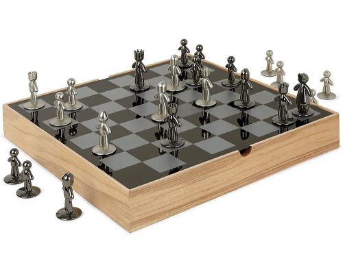 A natural wood and metal chess board